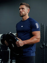 URBAN WOLFS men's navy mesh dry-fit t-shirt breathable fitted tee worn by muscular man lifting weight in gym